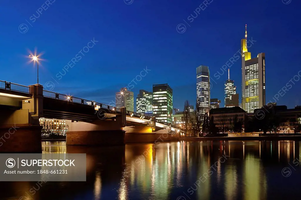 View towards Commerzbank Tower, European Central Bank, ECB, the Hessische Landesbank, Main Tower and Untermainbruecke Bridge at night, Frankfurt am Ma...