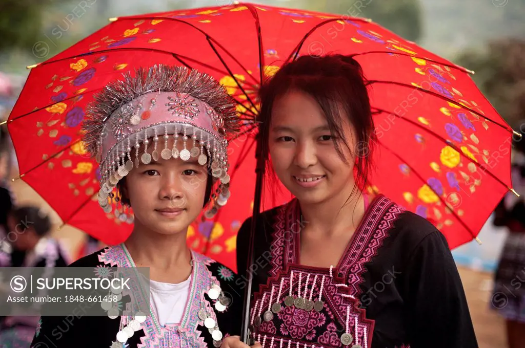 Two traditionally dressed Hmong women at a new year festival at Hung Saew village, Chiang Mai, Thailand, Asia