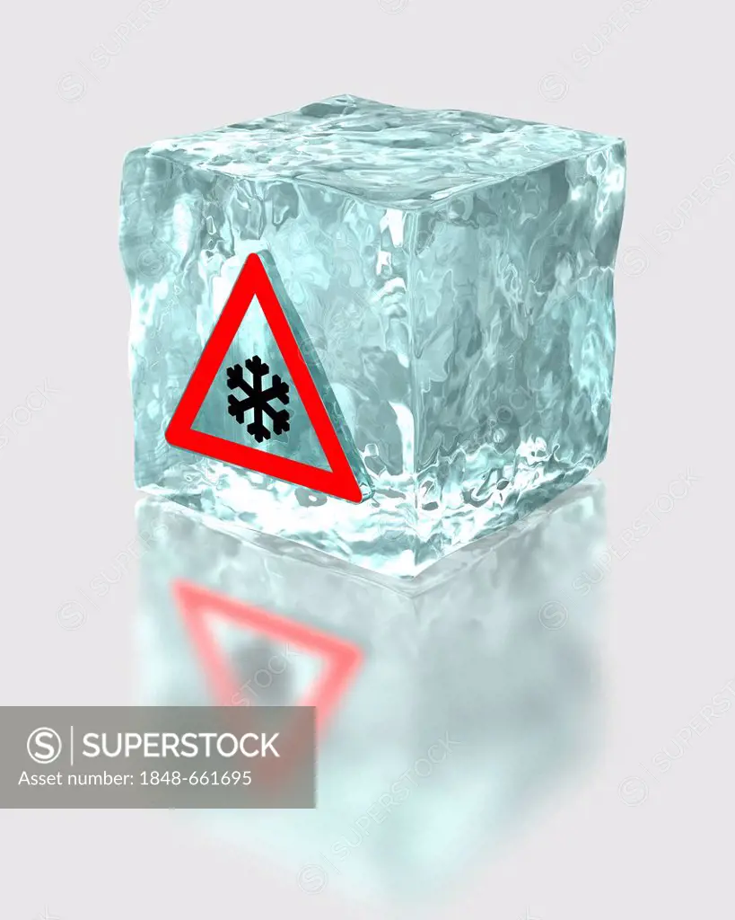Block of ice with a traffic warning sign for snow and icy roads, symbolic image for the mandatory use of winter tyres