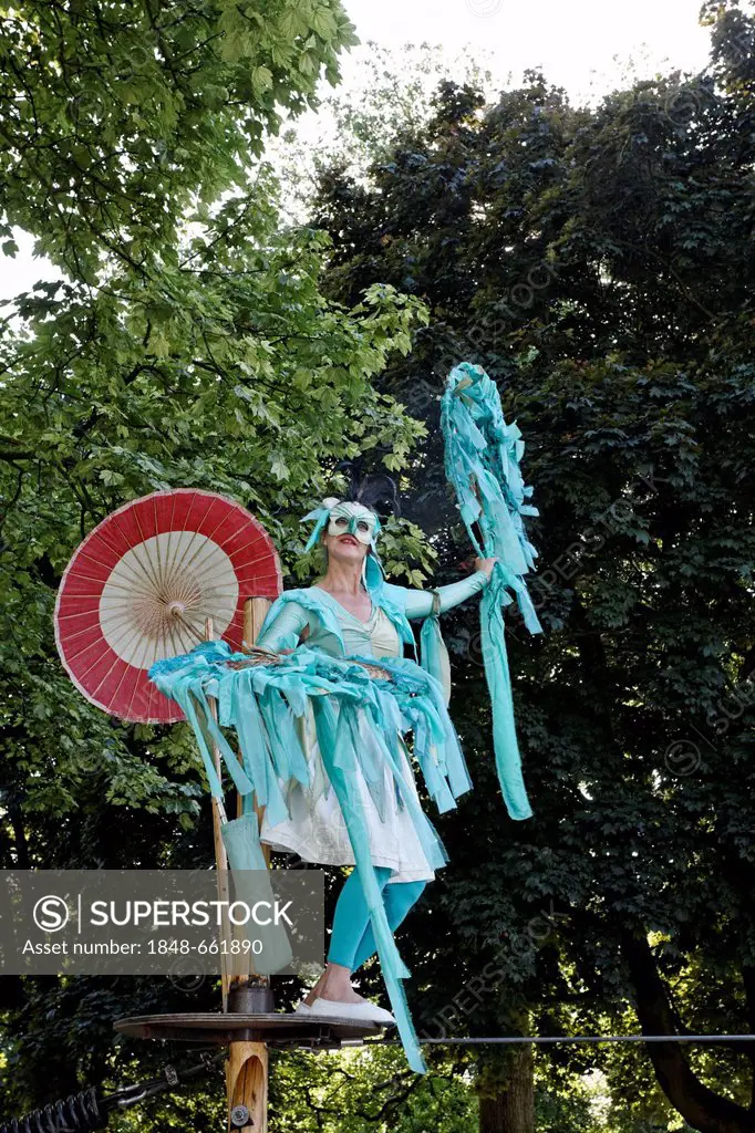 Artist on a high wire, tightrope, in costume, dance rope theatre, Flachsmarkt, flax market, Krefeld-Linn, Lower Rhine region, North Rhine-Westphalia, ...