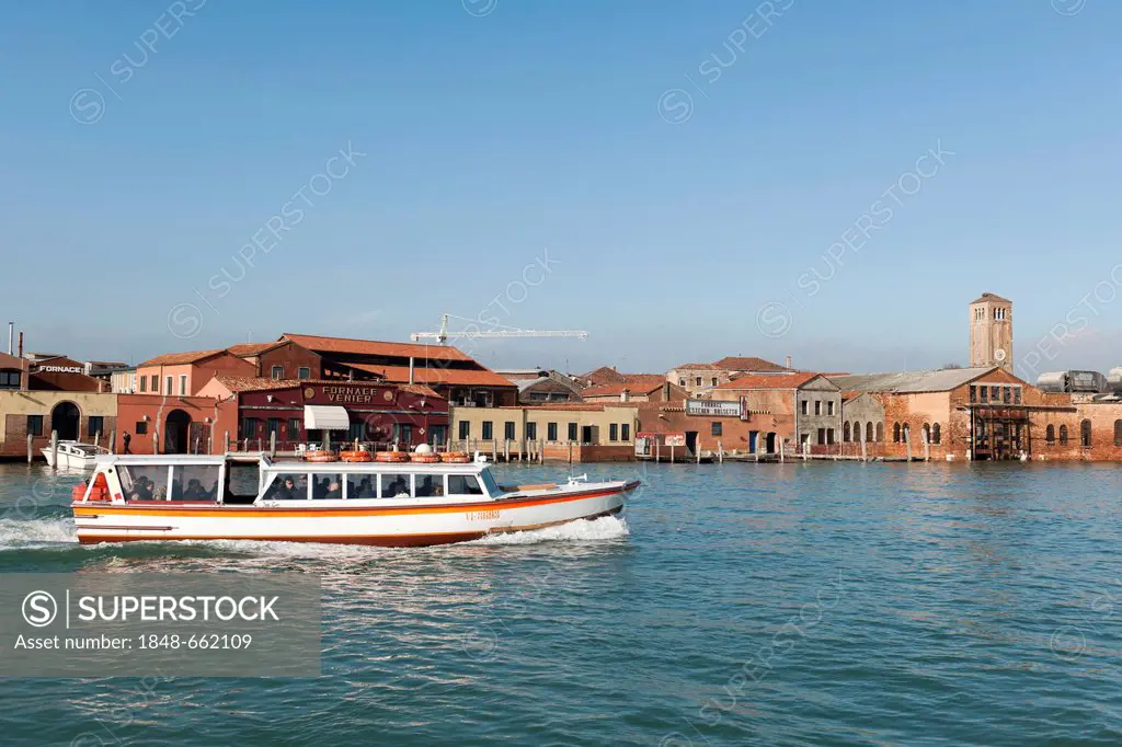 Workshops of the famous glass art on the lagoon island of Murano, a vaporetto in the foreground, Venice, Veneto, Italy, Southern Europe