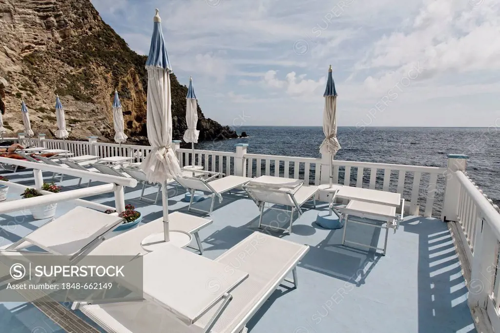 Sun terrace with sunloungers, Bay of Sorgeto, near Panza, Forio, Ischia Island, Gulf of Naples, Campania, Southern Italy, Italy, Europe
