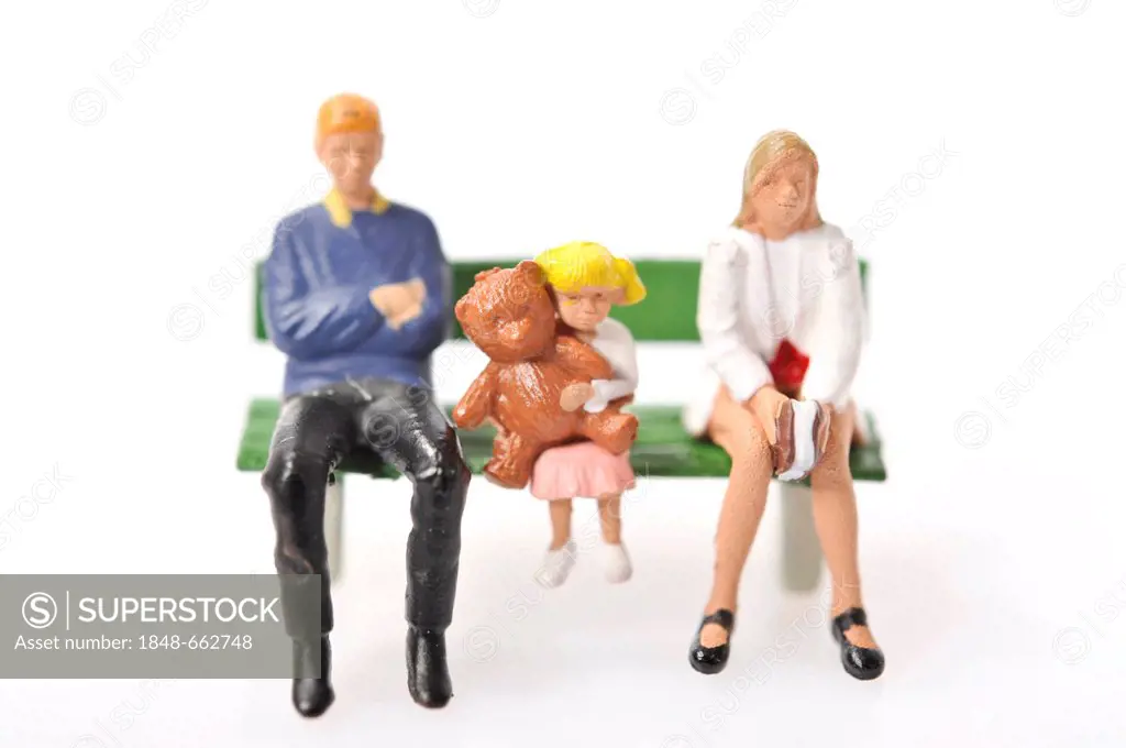 Figurines, family sitting on a bench