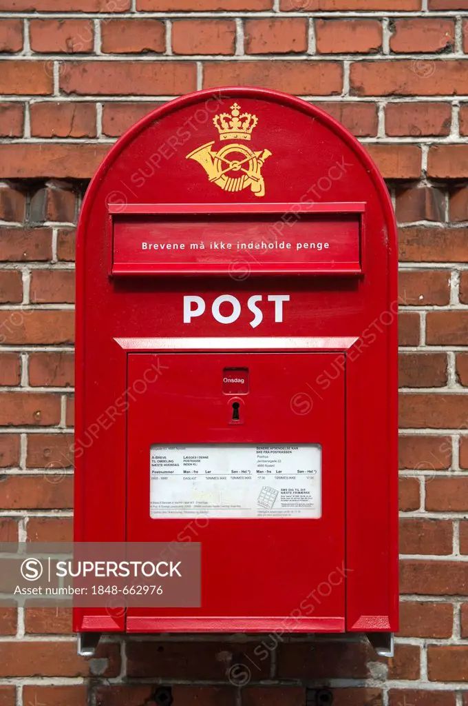 Red letter box of the Danish postal service Post Danmark, Nysted, Denmark, Europe