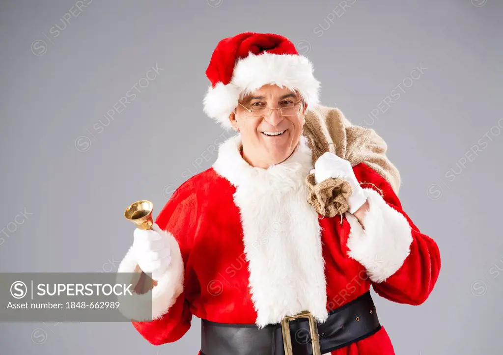 Santa Claus with a bag and a bell