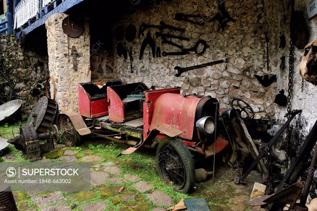 Scrap car, vintage car on the dilapidated Muricana farmyard near Paraty or Parati, Costa Verde, State of Rio de Janeiro, Brazil, South America