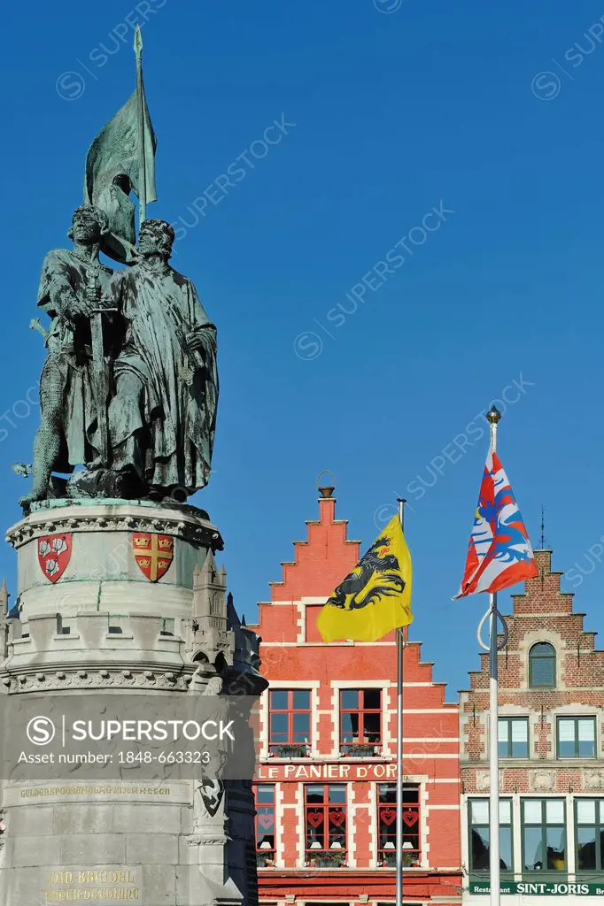 Statue of Jan Breydel and Pieter de Coninck, folk heroes, on the market square Grote Markt, in the historic centre of Bruges, Flanders, Belgium, Europ...