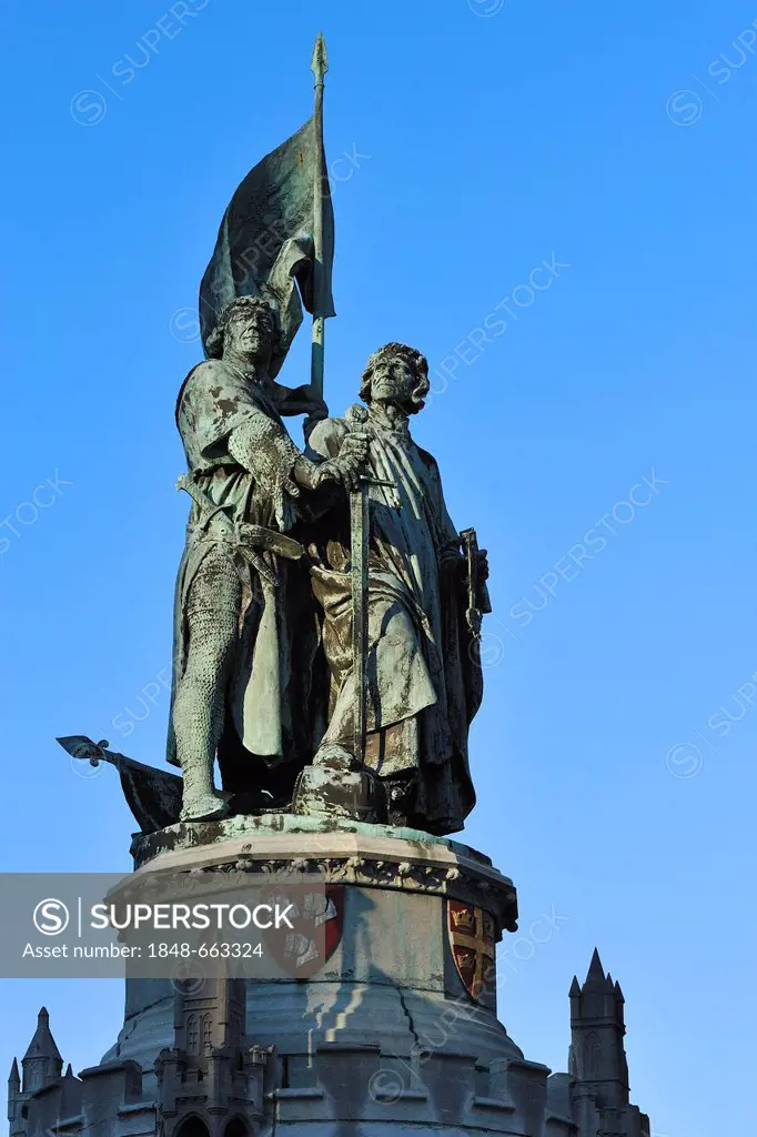 Statue of the Bruges folk heroes Jan Breydel and Pieter de Coninck, on the market square Grote Markt, in the historic centre of Bruges, Flanders, Belg...