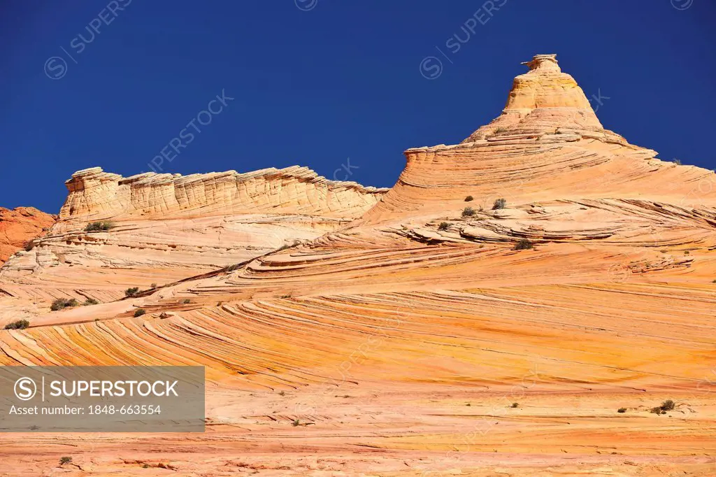 The Sentinel rock formation on the way to the sandstone rocks The Wave, North Coyote Buttes, Paria Canyon, Vermillion Cliffs National Monument, Arizon...