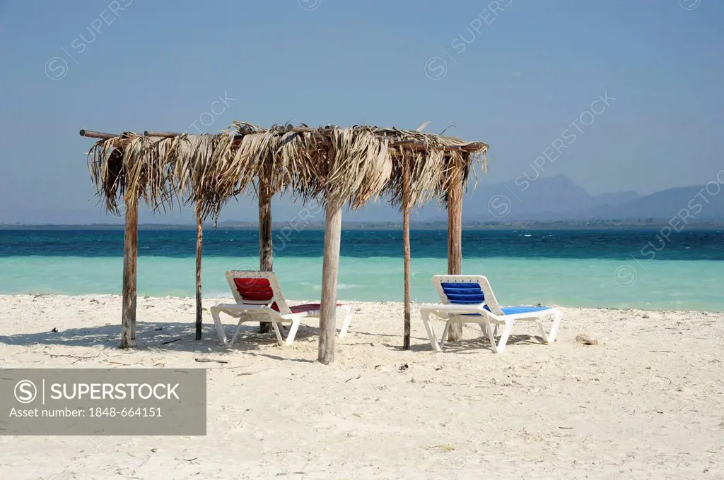 Two deck-chairs underneath a sunshade on the beach, Cayo Levisa island, Pinar del Rio province, Cuba, Greater Antilles, Gulf of Mexico, Caribbean, Cen...