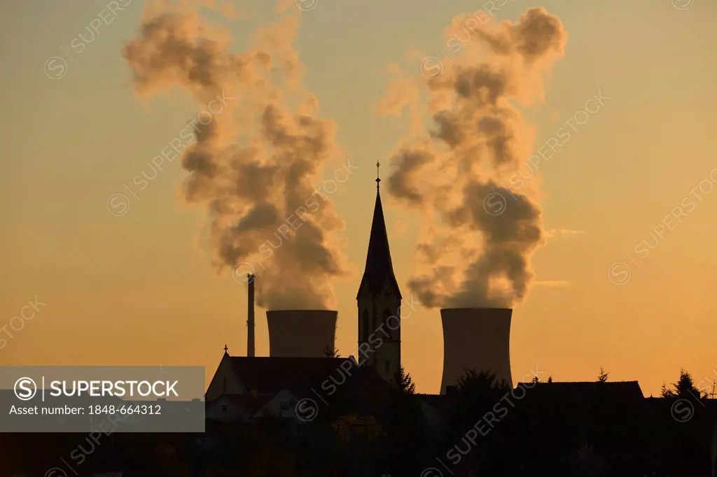 Church of Roethlein in front of Grafenrheinfeld nuclear power plant, silhouetted at dusk, Schweinfurt, Bavaria, Germany, Europe