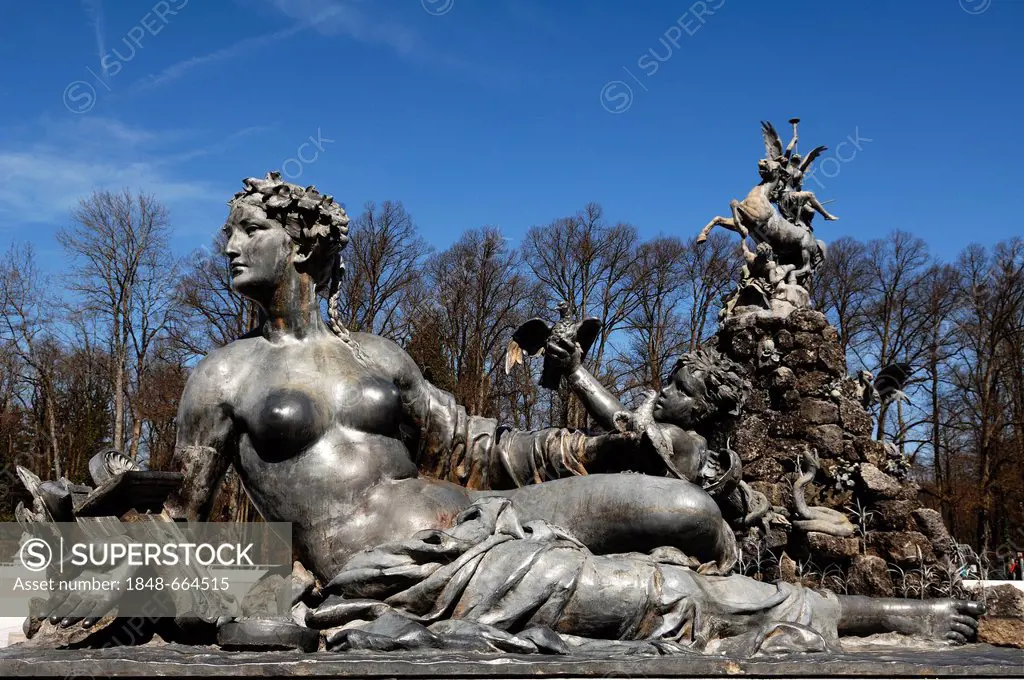 Mythological statue on the Fama fountain, by Rudolf Maison, built between 1884 and 1885, in front of Herrenchiemsee Palace, Herreninsel island, Bavari...