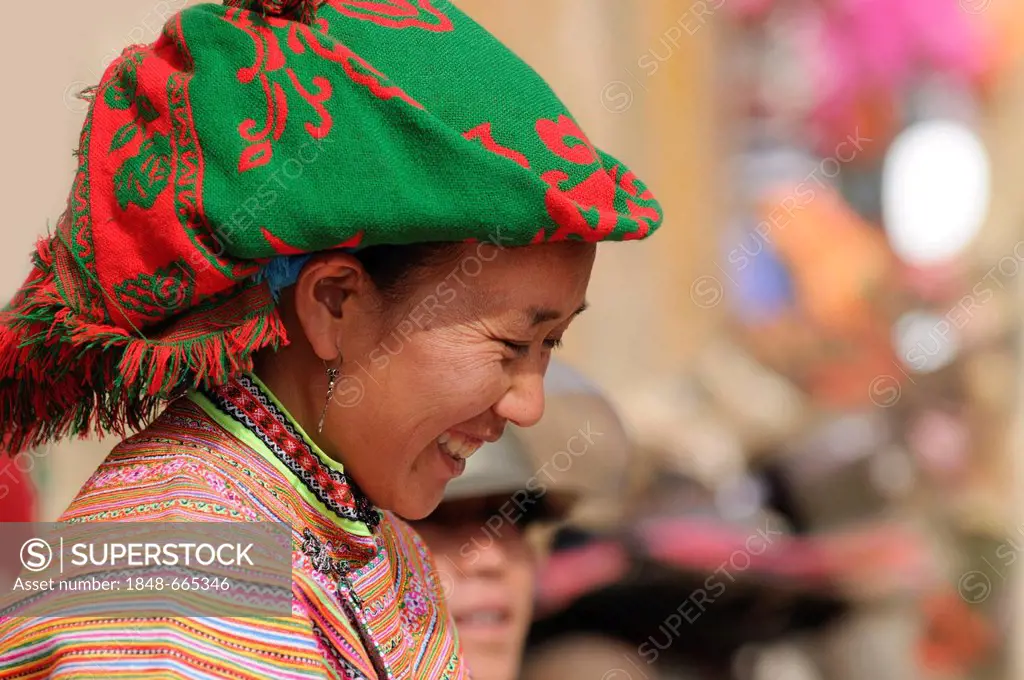 People's market, woman in the costume of the Hmong ethnic minority, Flower Hmong ethnic group, Sin Cheng, Si Ma Cai District, Vietnam, Asia