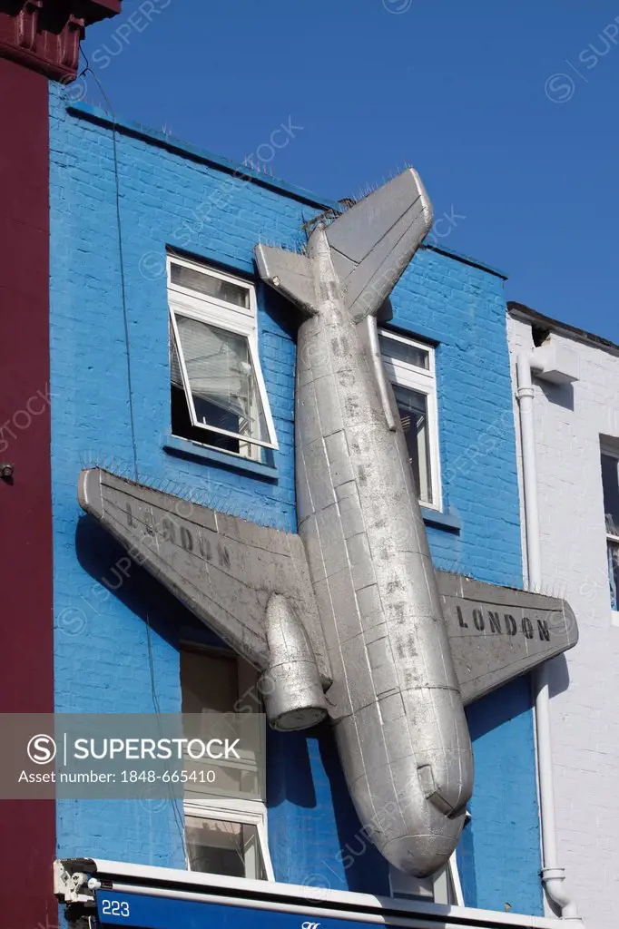 Colourfully decorated facade featuring an aeroplane at Camden Market, Camden Town, London, England, United Kingdom, Europe