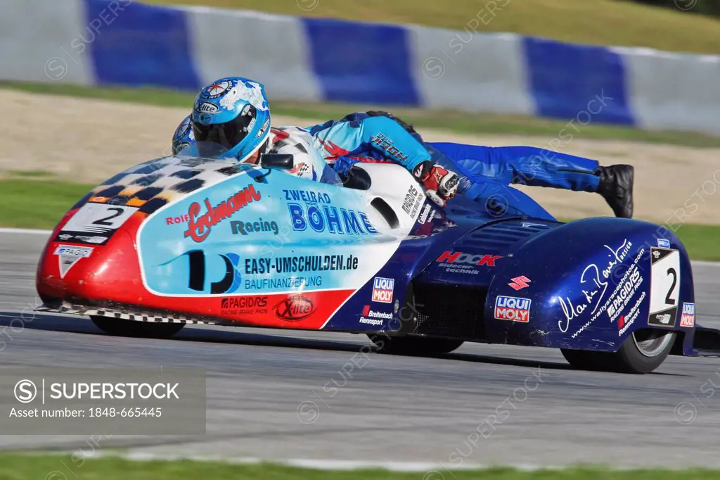Motorcycle racers Mike Roscher and Danny Kamerbeek, Germany, compete in the Sidecar cup on August 20. 2011 in Zeltweg, Austria, Europe