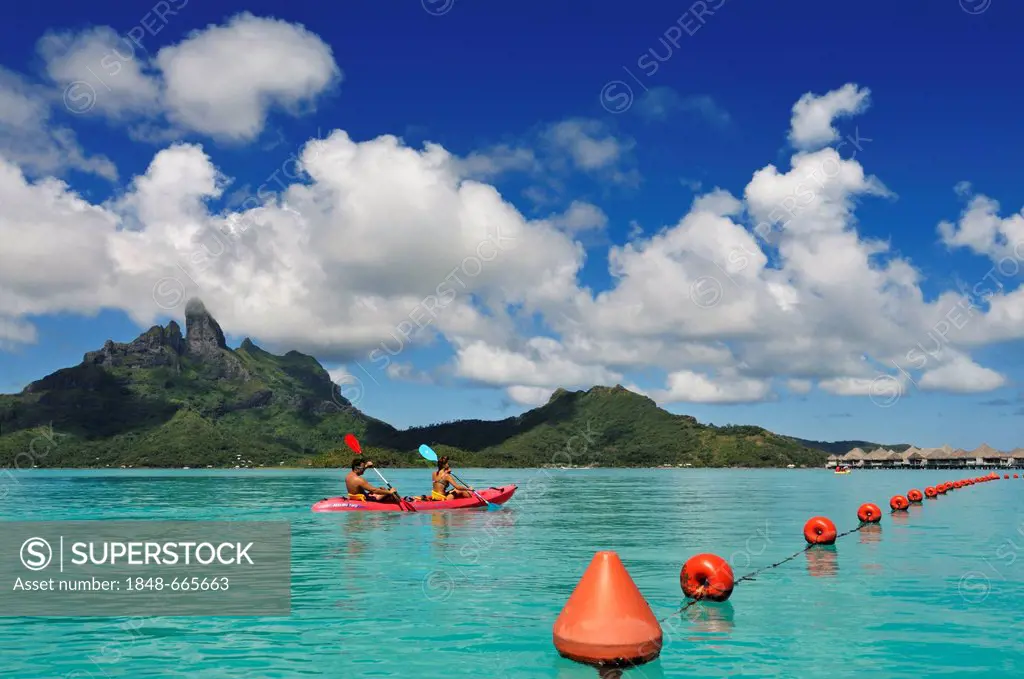 Tourists in a kayak, St. Regis Bora Bora Resort, Bora Bora, Leeward Islands, Society Islands, French Polynesia, Pacific Ocean