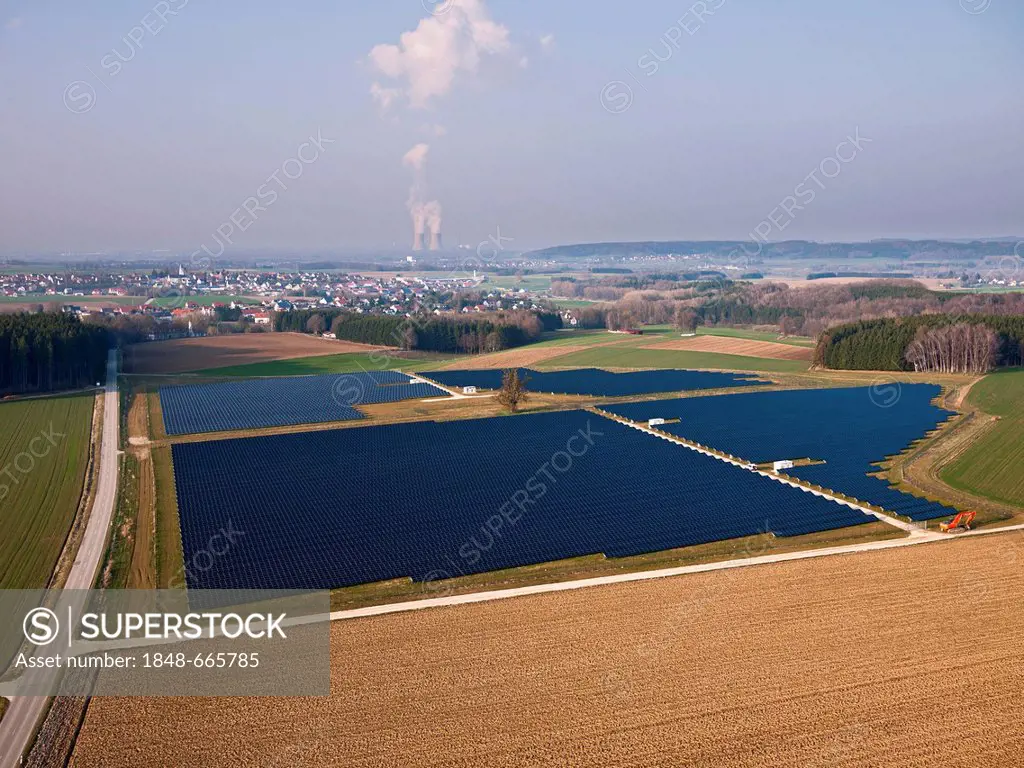 Aerial view, array of solar panels, Gundremmingen nuclear power plant at back, Harthausen, Swabia, Bavaria, Germany, Europe