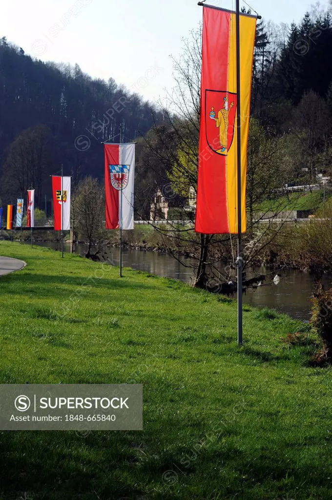 Flags on the waterside promenade of the Wiesent River, flag of the town of Waischenfeld, Upper Franconia, Franconia, Bavaria, Germany, Europe