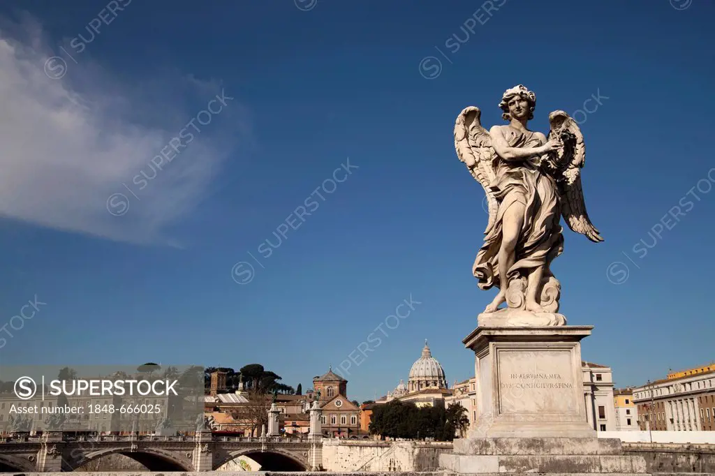 Angel by Bernini on the Ponte Sant'Angelo bridge and cityscape with St. Peter's Basilica in Rome, Lazio, Italy, Europe