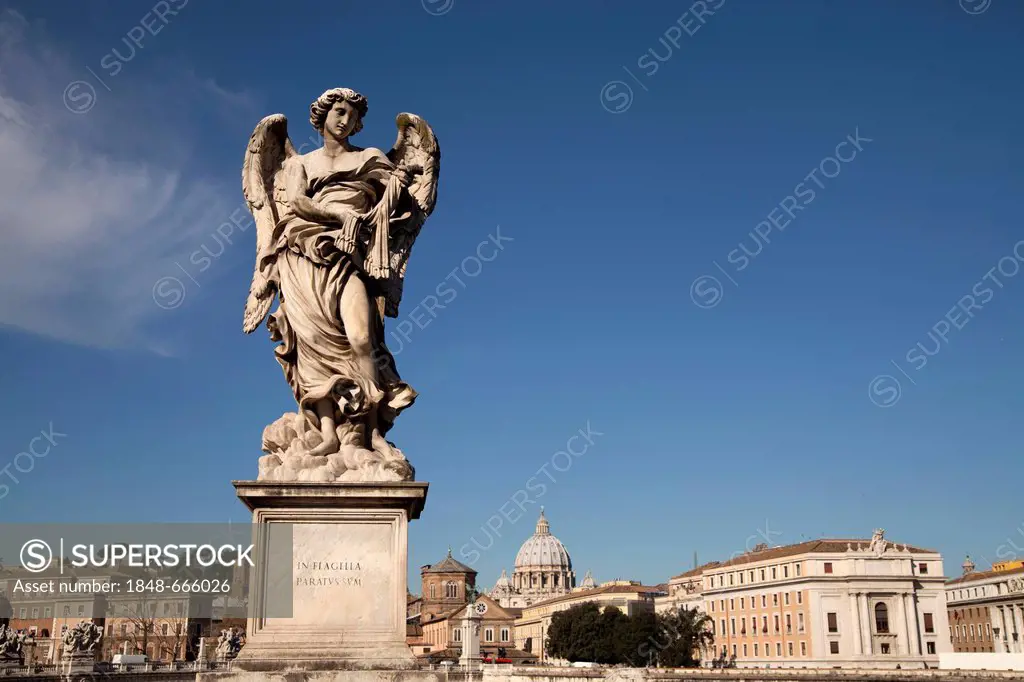Angel by Bernini on the Ponte Sant'Angelo bridge and cityscape with St. Peter's Basilica in Rome, Lazio, Italy, Europe