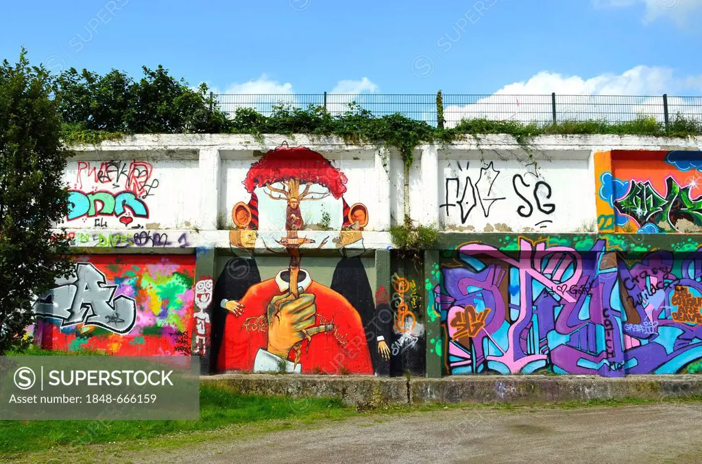 Graffiti on a wall along the Rhine-Herne Canal, Zeche Nordstern Mine, Nordsternpark, Gelsenkirchen, Ruhr area, North Rhine-Westphalia, Germany, Europe