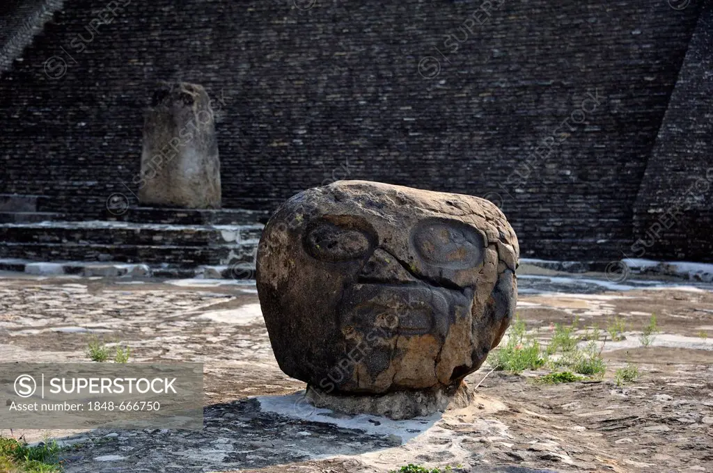 Stone head in the archaeological excavation site of the pre-Hispanic Pyramid of Cholula, San Pedro Cholula, Puebla, Mexico, Latin America, North Ameri...