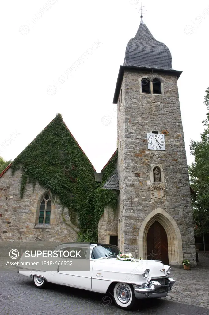 Vintage car decorated as a wedding car in front of a church, wedding in Muenster, North Rhine-Westphalia, Germany, Europe