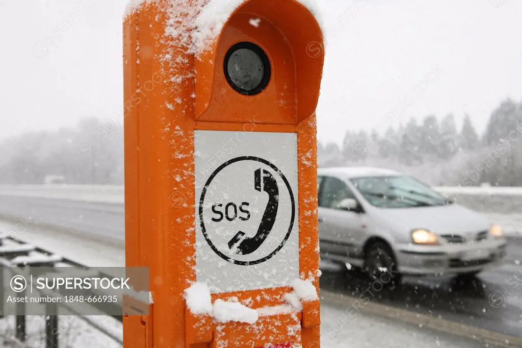 Emergency telephone on a motorway with snow and ice in winter, Germany, Europe