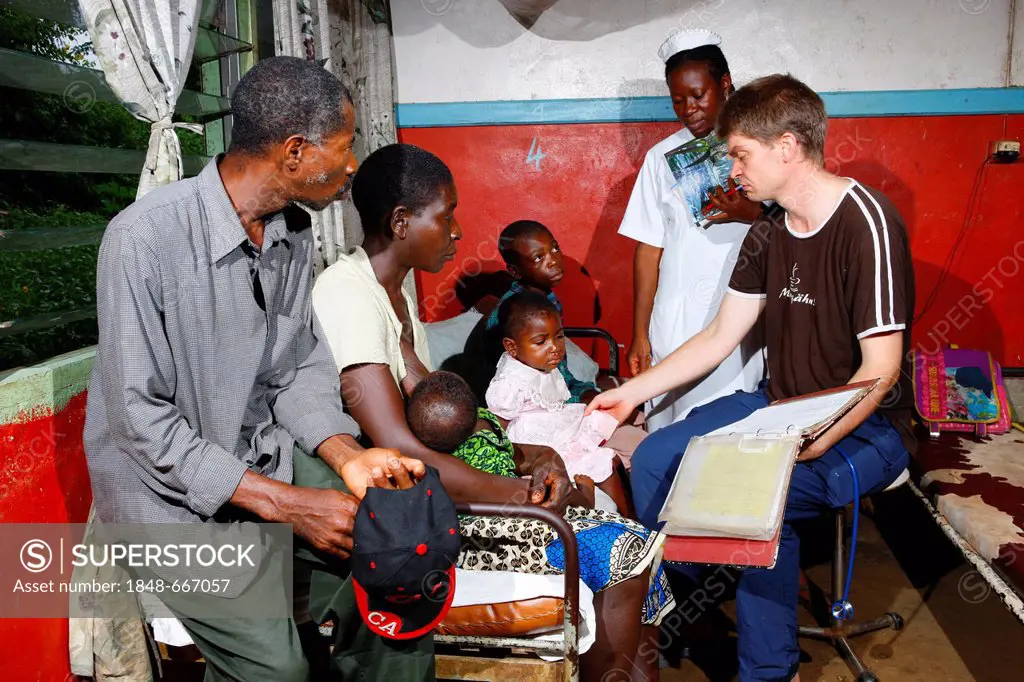 Doctors examining children, ward round in the children's ward, hospital, Manyemen, Cameroon, Africa
