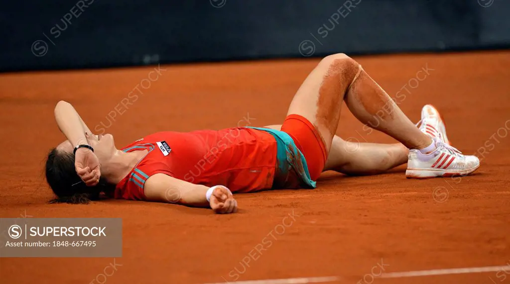 Andrea Petkovic, GER, lying on the ground, badly injured, with two torn ligaments, taking off shoe, Porsche Tennis Grand Prix, Porsche Cup, women's to...