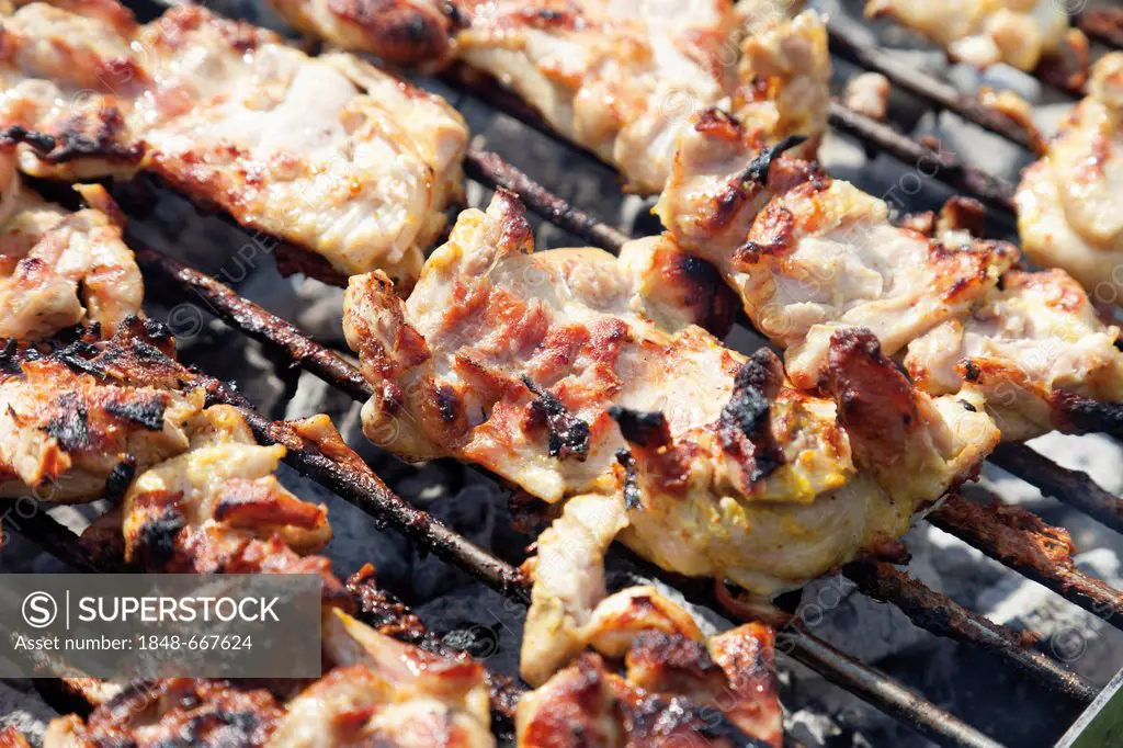 Chicken meat on a charcoal grill