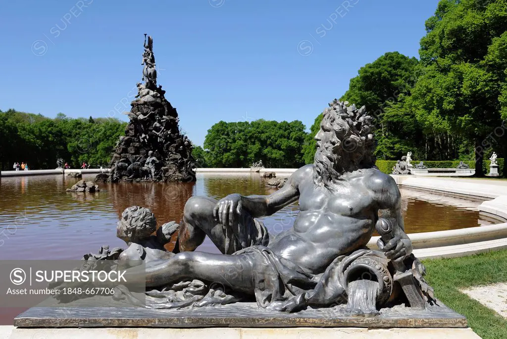 Mythological figure on the edge of the pond of the Fama Fountain, by Rudolf Maison 1884-85, in front of the Schloss Herrenchiemsee Palace, Herrenchiem...