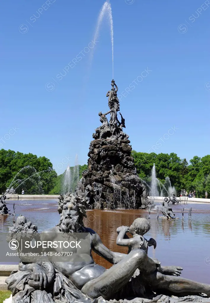 Mythological figure on the edge of the pond of the Fama Fountain, by Rudolf Maison 1884-85, in front of the Schloss Herrenchiemsee Palace, Herrenchiem...