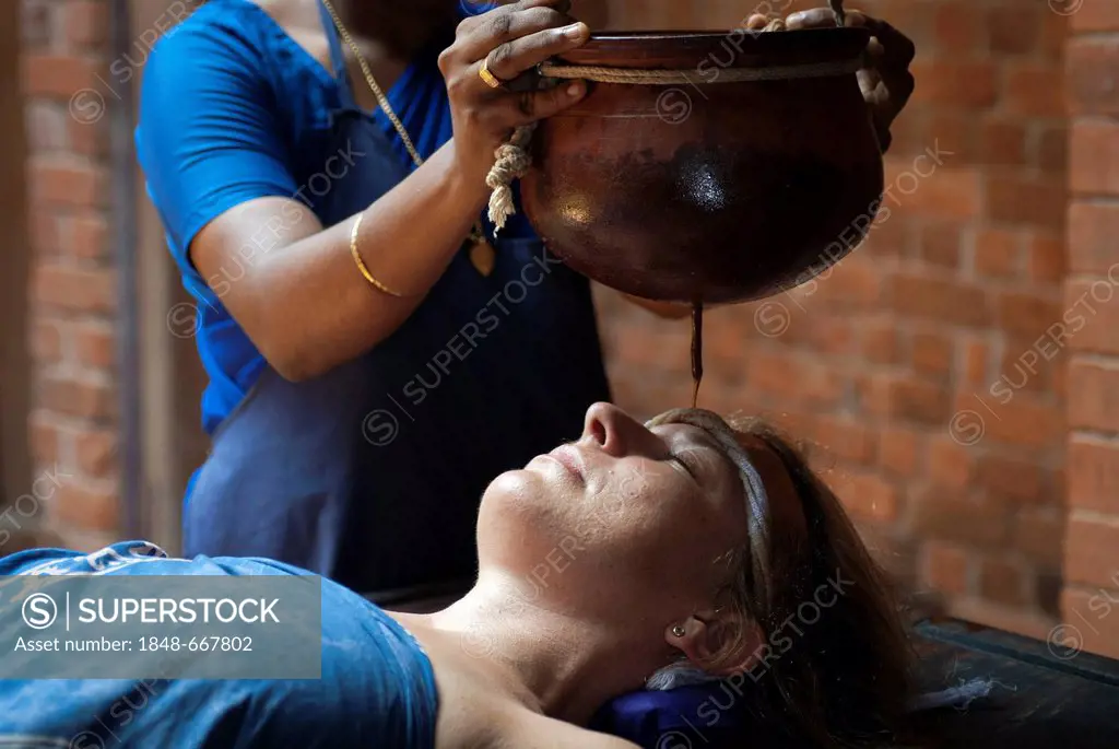 Shirodhara, Ayurvedic treatment, oil is gently poured over the forehead, Somatheeram Ayurvedic Health Resort, Chowara, Malabar Coast, South India, Ind...