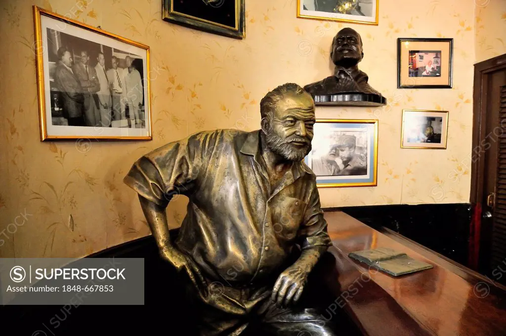 Bronze statue of Ernest Hemingway in the Bar Floridita, Hemingway's favorite bar in the old town Habana Vieja, Havana, Cuba, Caribbean