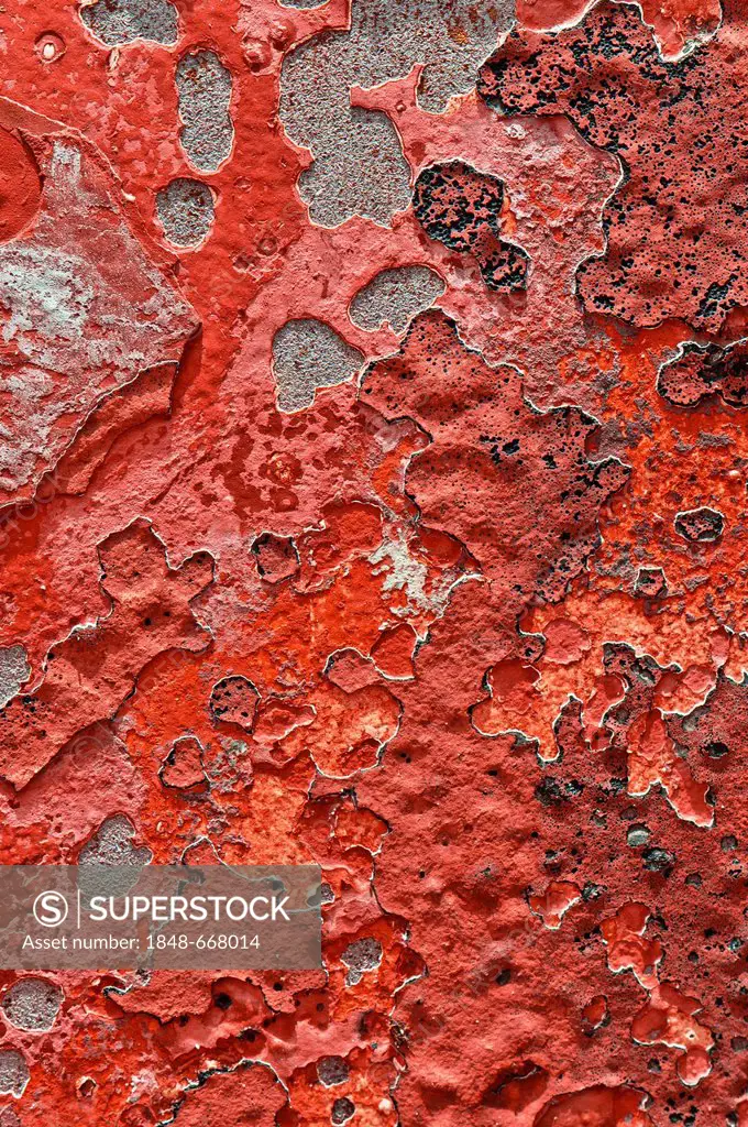 Metal surface with remnants of red paint, texture, background