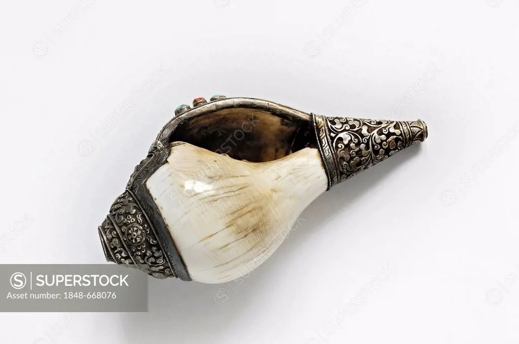 Shell of a Sacred Chank or Diveine Conch (Turbinella pyrum) decorated with silver and semiprecious stones, from Tibet, the simplest and oldest trumpet...