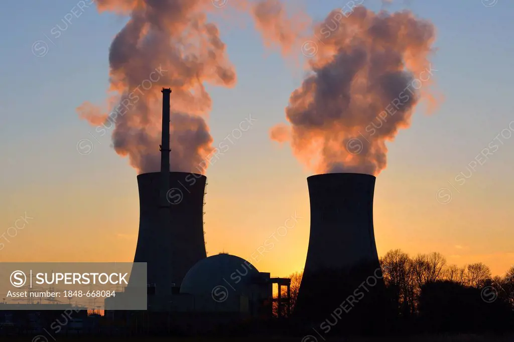 Grafenrheinfeld nuclear power plant operated by E.ON, silhouetted at dusk, Schweinfurt, Bavaria, Germany, Europe