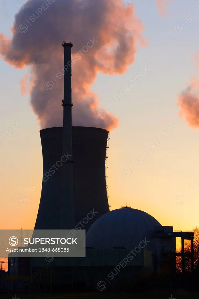 Grafenrheinfeld nuclear power plant operated by E.ON, silhouetted at dusk, Schweinfurt, Bavaria, Germany, Europe