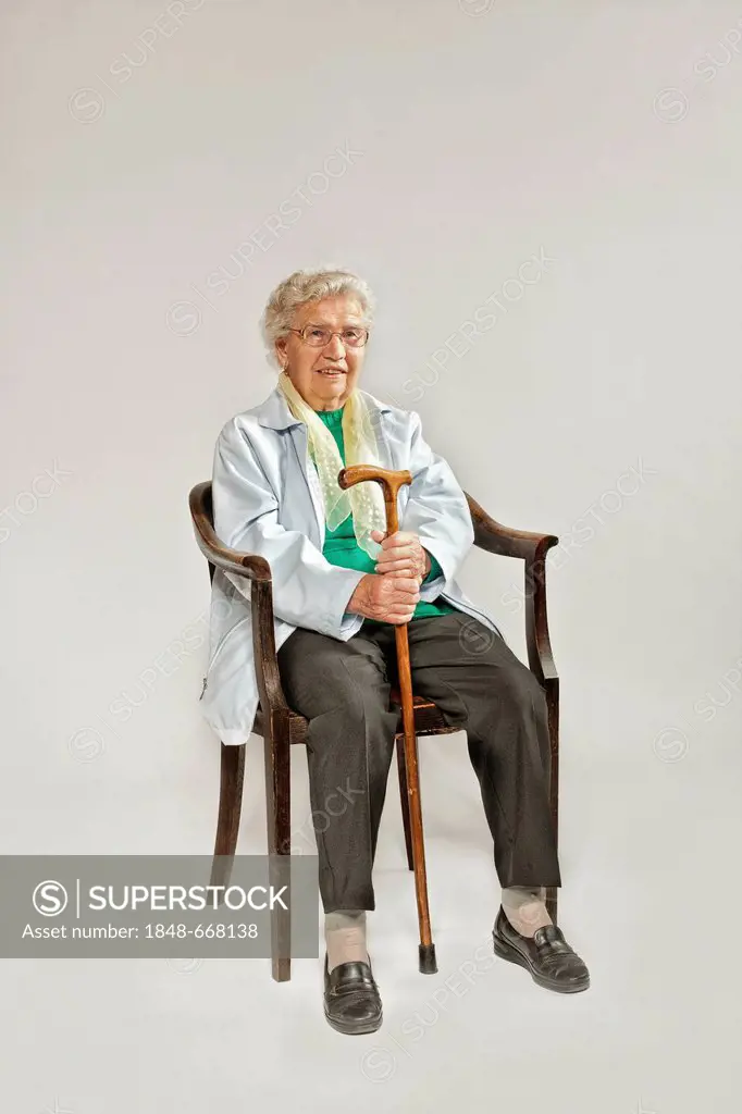 Old woman holding a walking cane