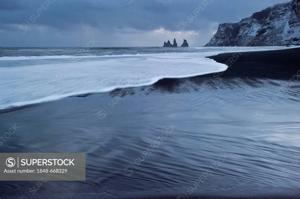 The Reynisdrangar pinnacles on the wintry Reynisfjara beach at Vik I Myrdal, Iceland, Europe