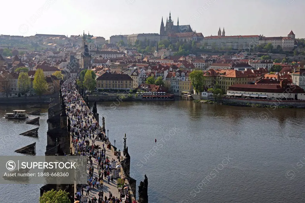 View from the Old Town bridge tower over the Charles Bridge to the Mala Strana with St. Vitus Cathedral, Prague, Bohemia, Czech Republic, Europe