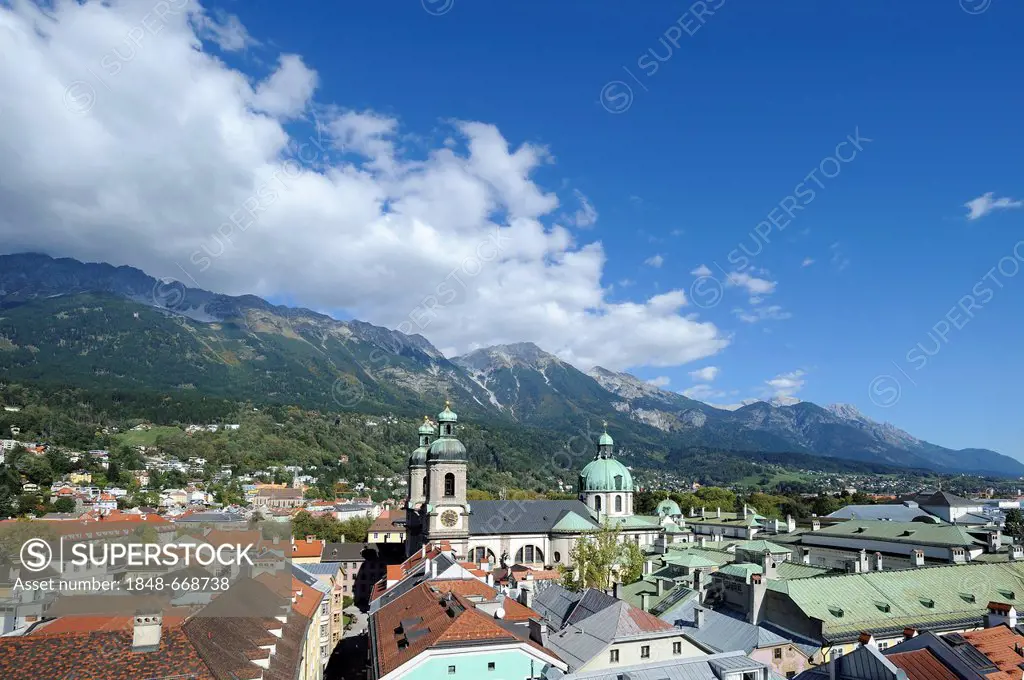 View of the historic district and the Cathedral of St. Jacob as seen from Stadtturm tower, northern Karwendel mountain range at the back, Innsbruck, T...