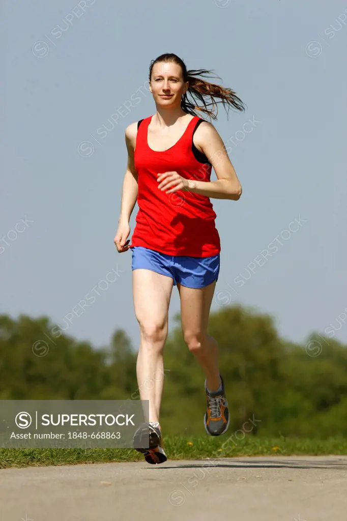 Recreational runner, young woman, 25-30 years, jogging