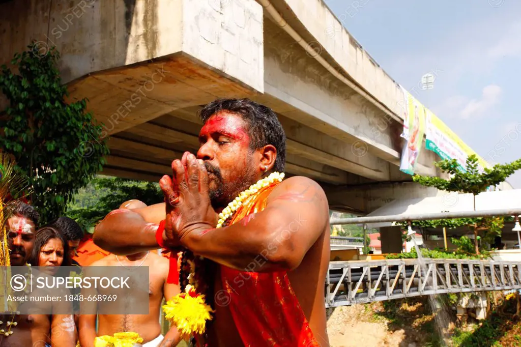 Saint man praying, Hindu festival Thaipusam, Batu Caves limestone caves and temples, Kuala Lumpur, Malaysia, Southeast Asia, Asia