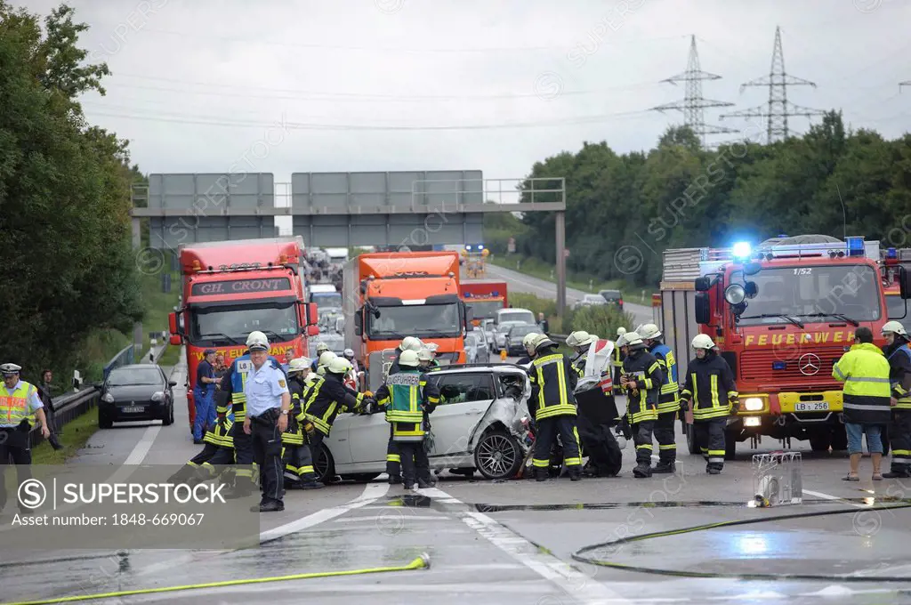 Firefighters in a rescue operations following a serious road traffic accident on the Autobahn A81 motorway, Ludwigsburg, Baden-Wuerttemberg, Germany, ...