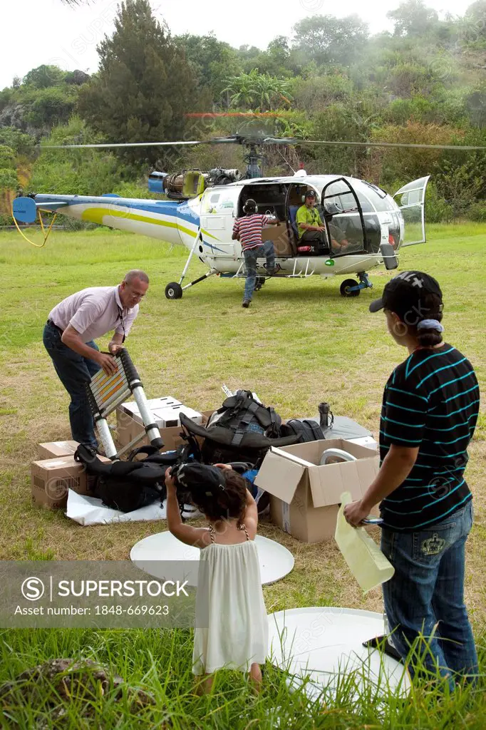 Supply by helicopter, remote and hard to reach mountain village of La Nouvelle, Cirque de Mafate caldera, La Reunion island, Indian Ocean