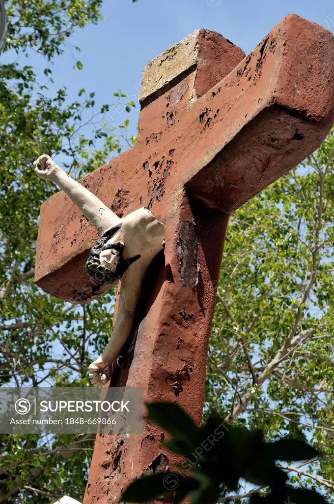 Destroyed Jesus figure hanging from a crucifix, destroyed by the earthquake in January 2010, Sacre Coeur church, Turgeau district, Port-au-Prince, Hai...