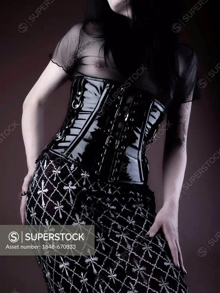 Woman, Gothic, dress, glossy vinyl skirt with corset, standing