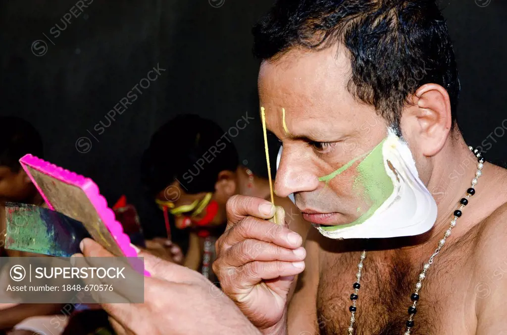 The make-up of the Kathakali character Jayantha is being applied, Varkala, Kerala, India, Asia